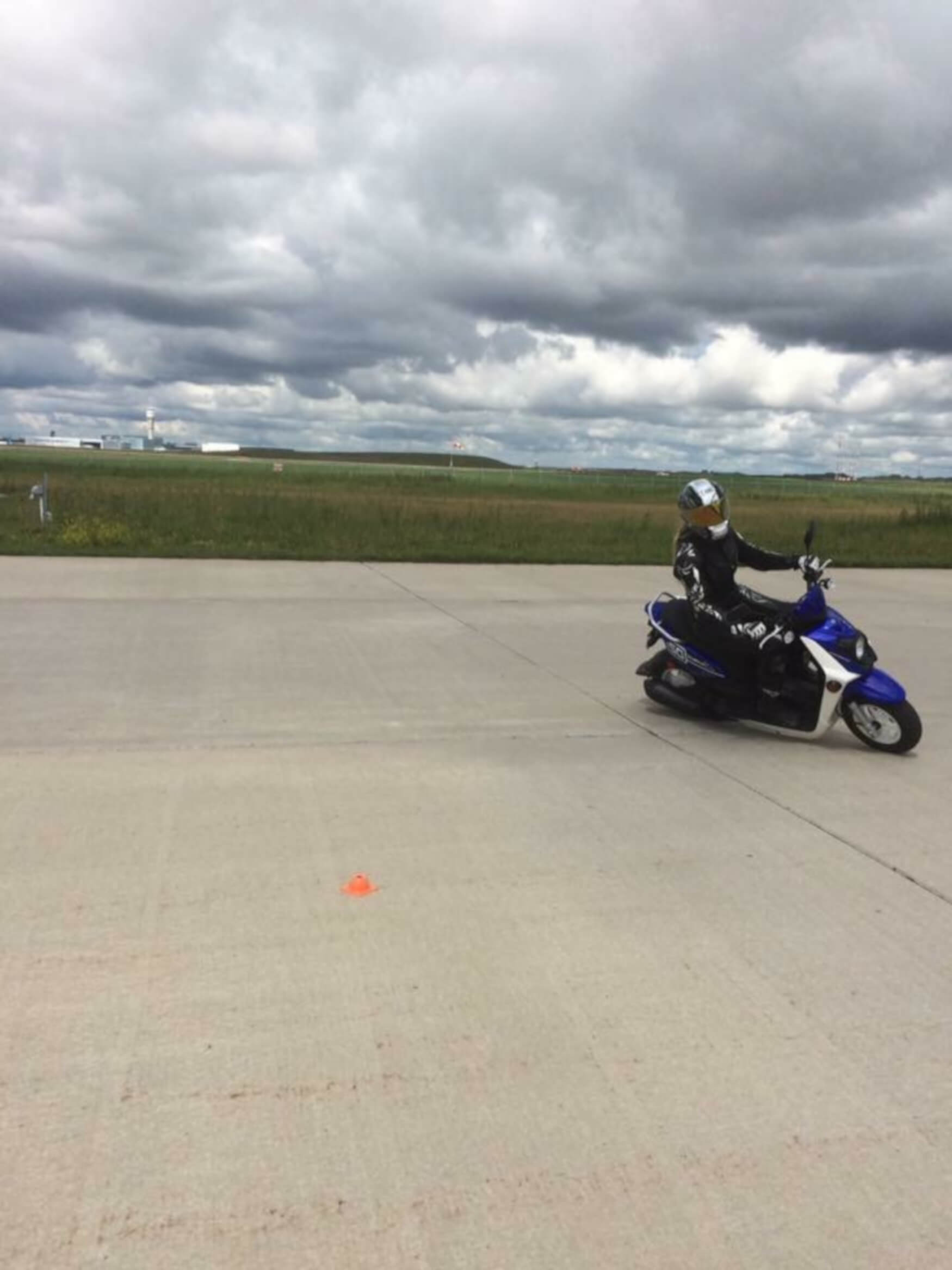 Jennifer Angelina giving a demo on the scooter of countersteering