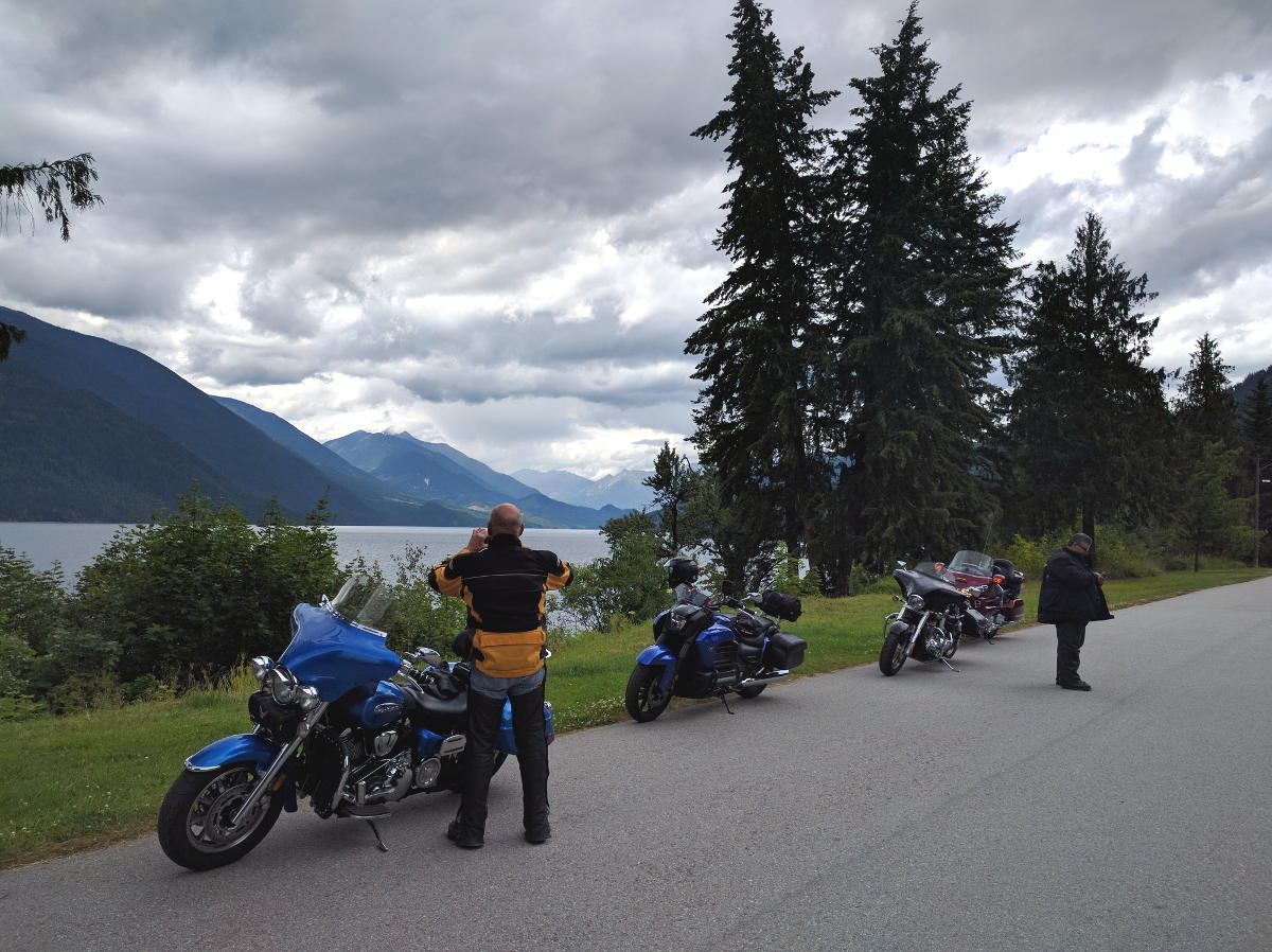 A trio of motorcyclists enjoying the view