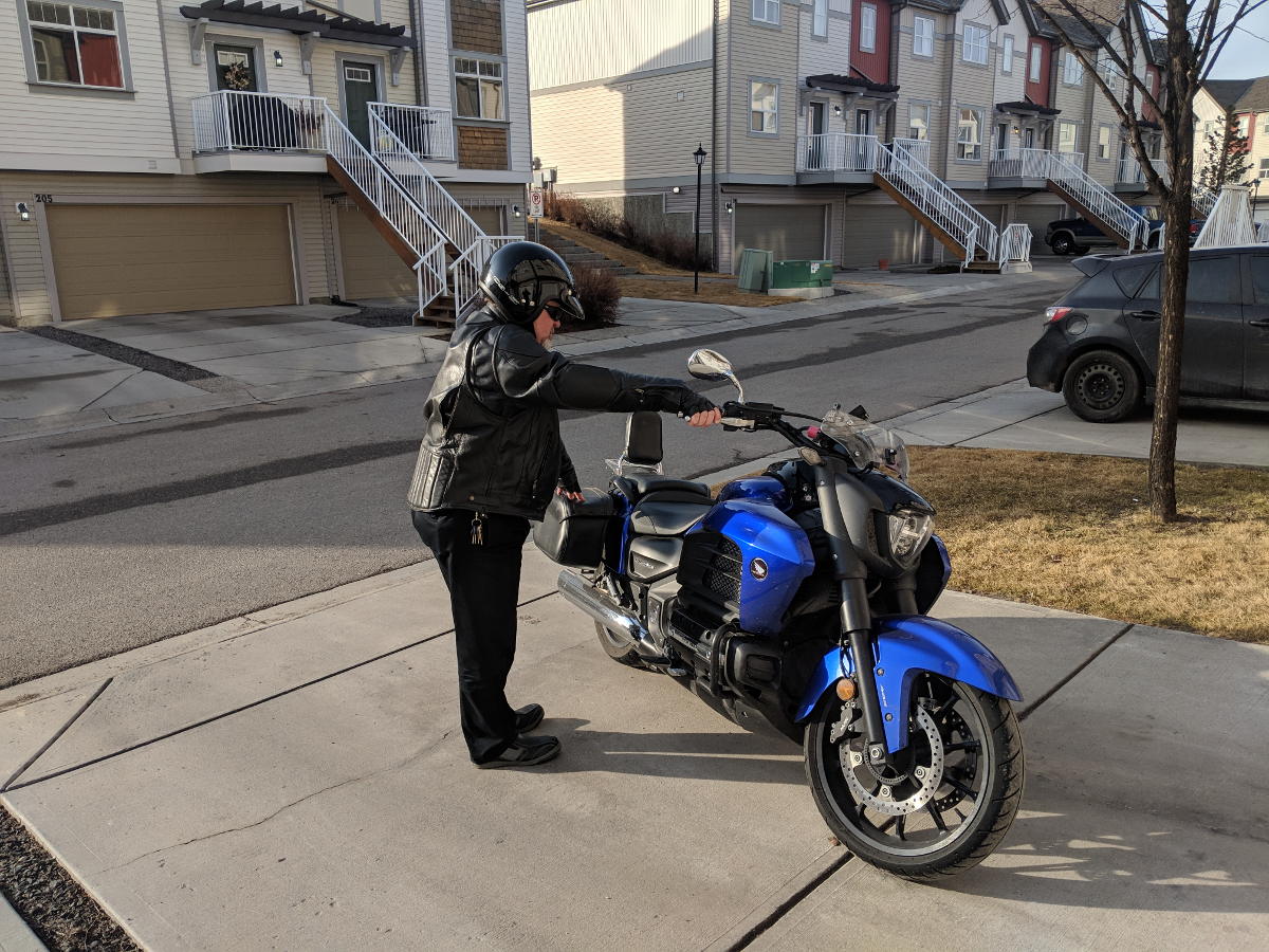 Reverse kick mounting a motorcycle