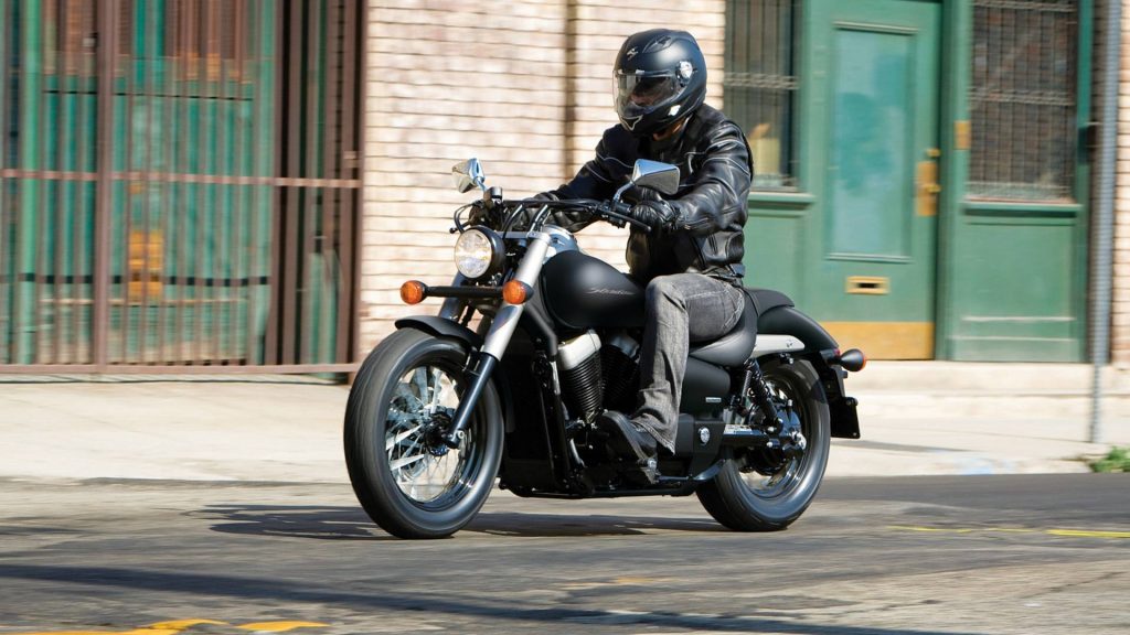 Person riding Honda Shadow Phantom 750 on city street