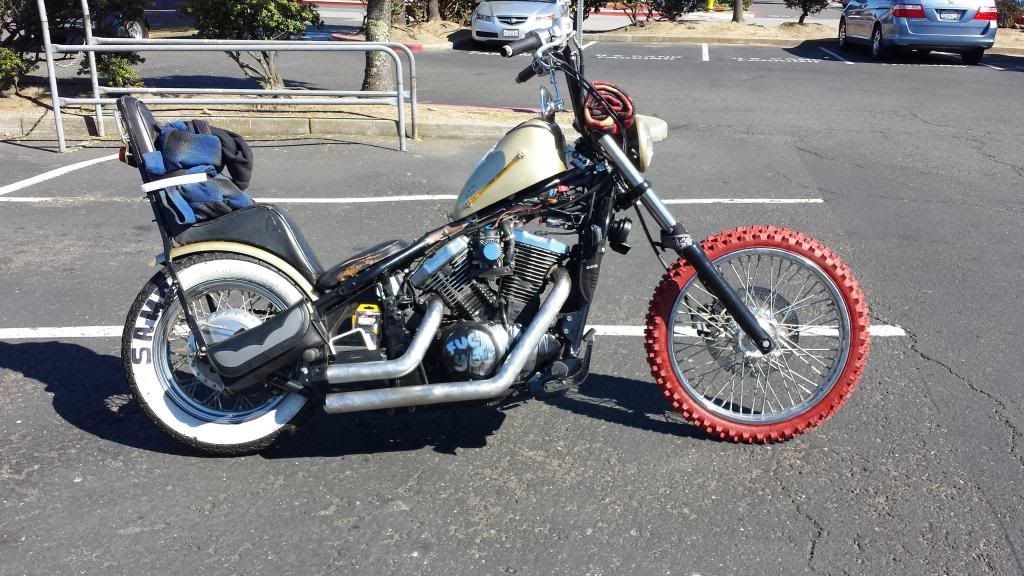 a custom rat chopper with mismatched tyres