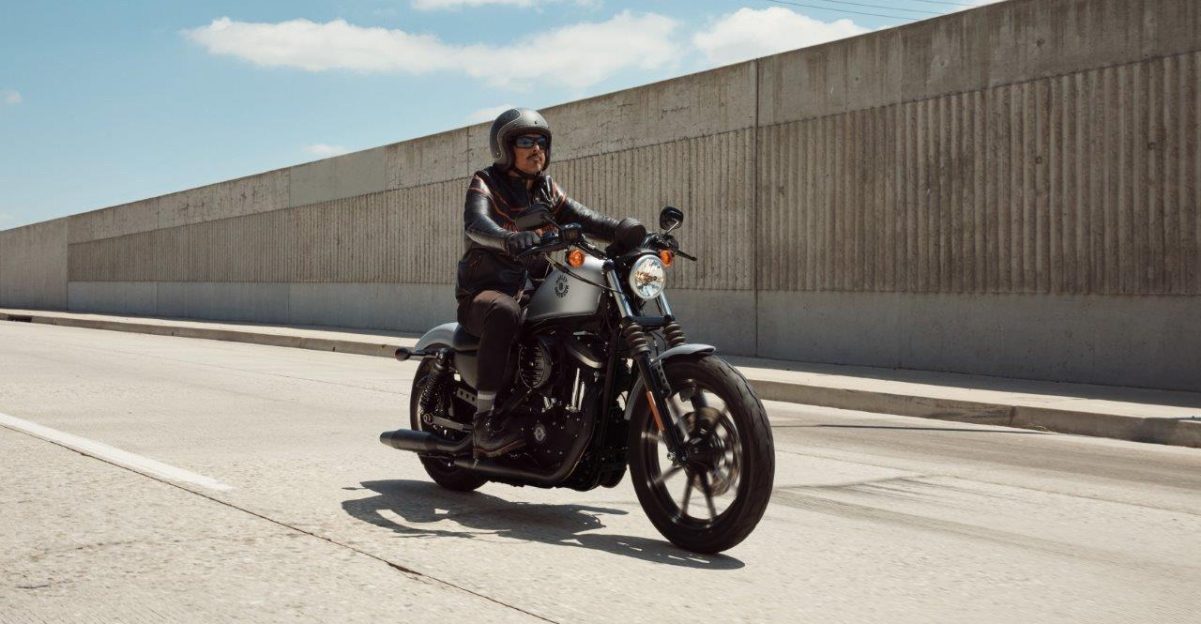 Rider on Harley-Davidson Iron 883 on city highway