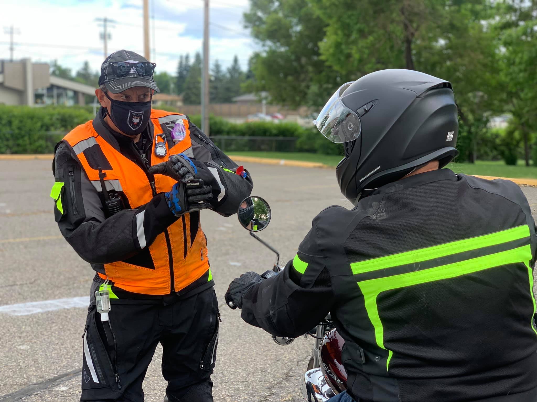 Motorcycle instructor teaching a new rider