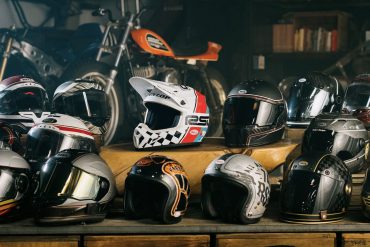 Shelf with various helmets resting on it