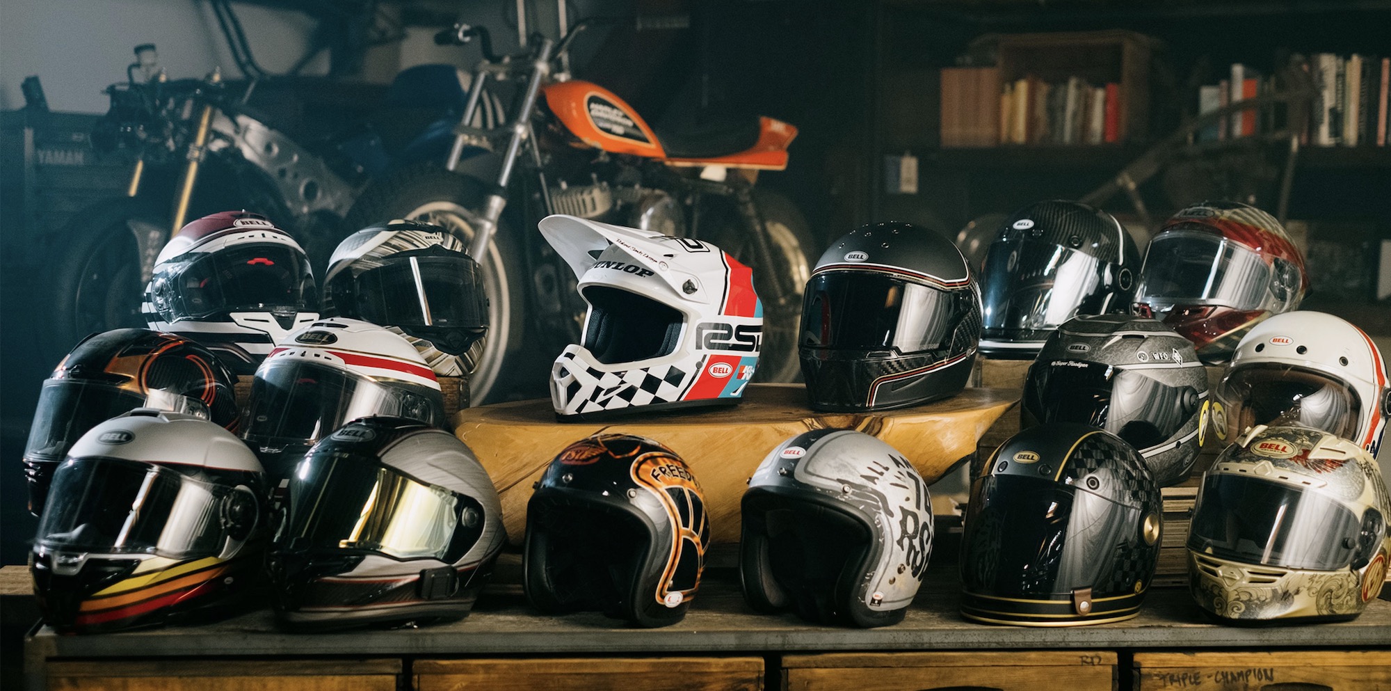 Shelf with various helmets resting on it