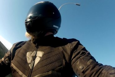 Author wearing full face helmet and textile jacket as beginner motorcyclist