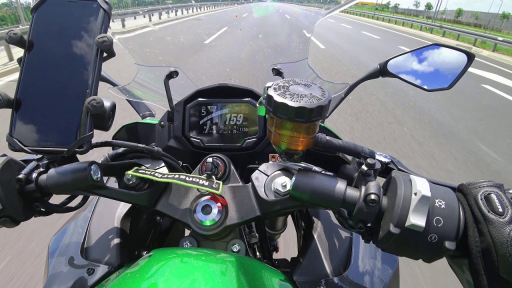 a close-up shot of the dash of a Kawasaki Motorcycle with iPhone