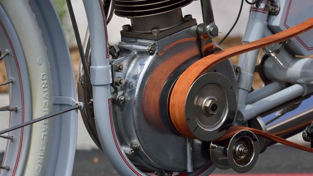A leather and canvas belt drive with tensioning pulley from a 1910 Harley Davidson