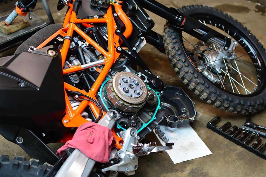 A motorcycle undergoing a clutch change in a workshop
