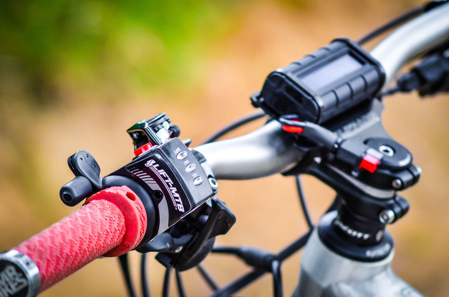 Close up shot of an electric mountain bike model with red twist throttle