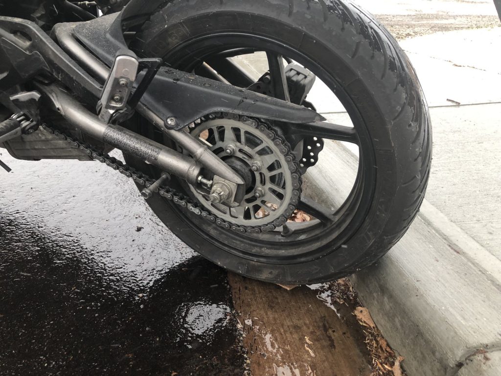 Rear tire of writer's bike against the curb