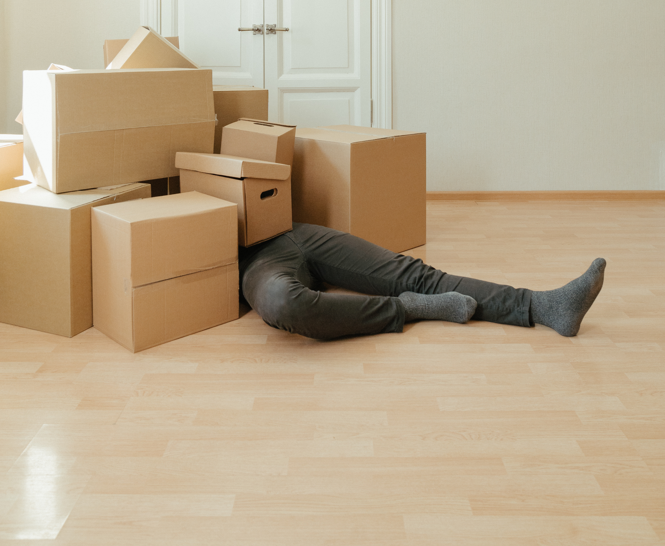 Man buried in moving boxes