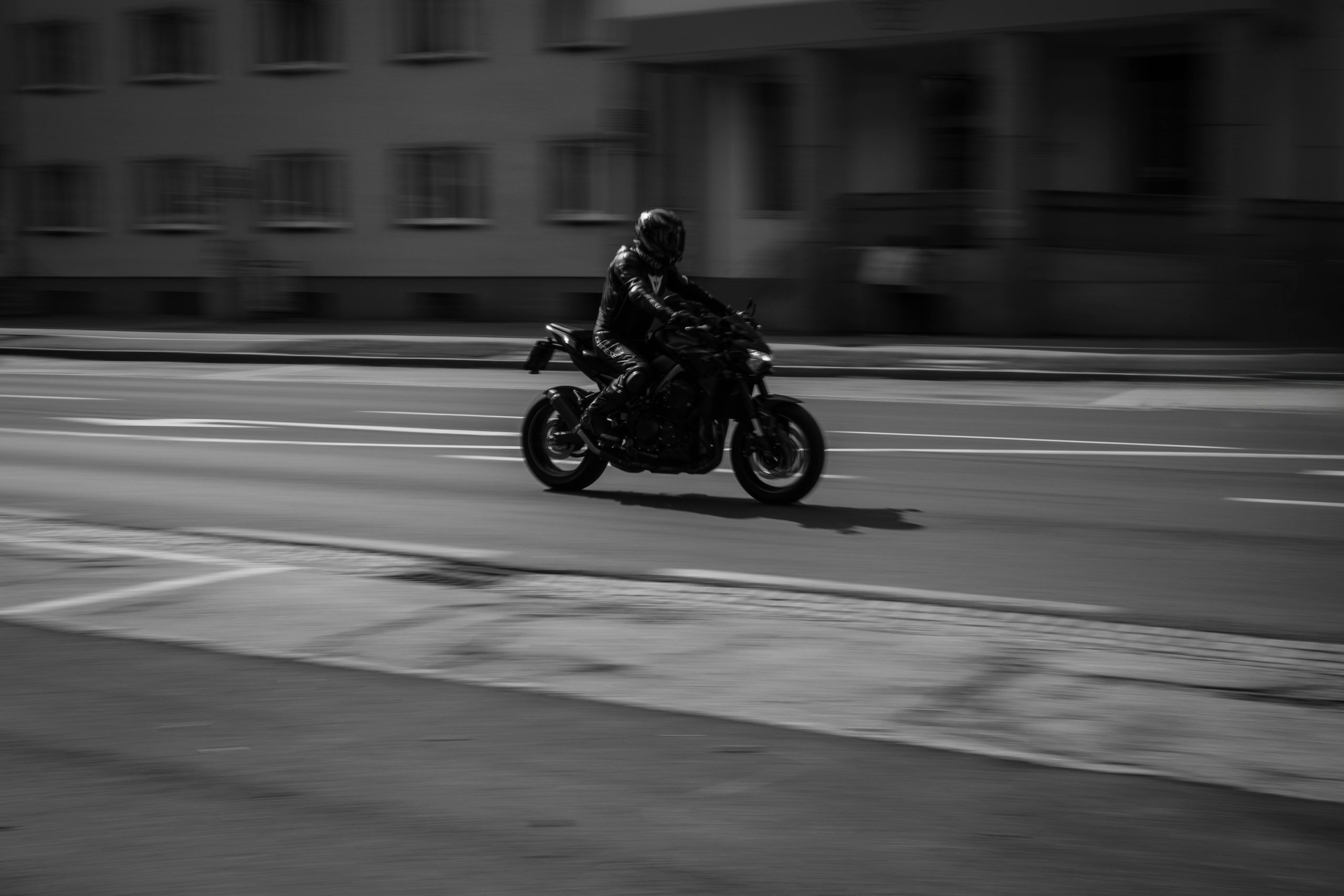 Motorcyclist cruising on a city street